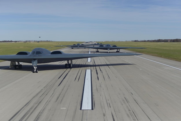 A b - 2 bomber is parked on a runway.