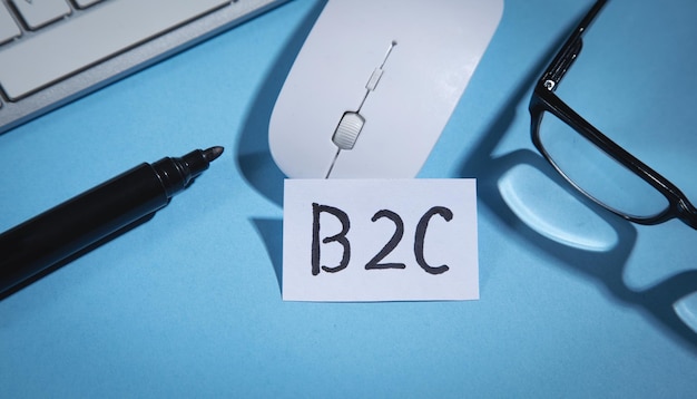 B2C on paper with a computer mouse marker