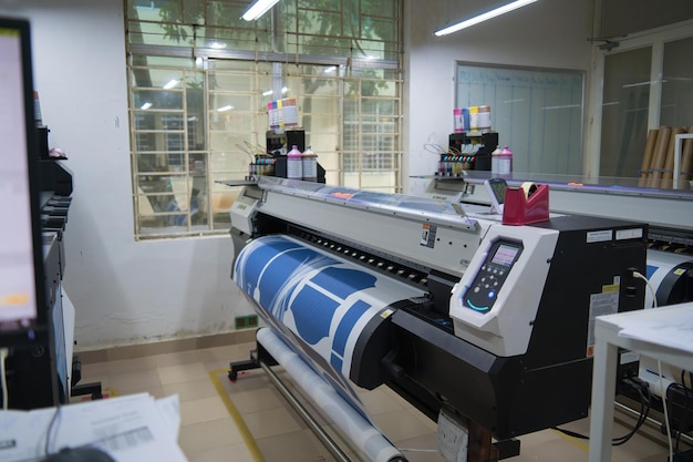 Ba Ria VIETNAM OCT 20 2022 Interior factory Large printing machine for paper business in printing room Sublimation concept