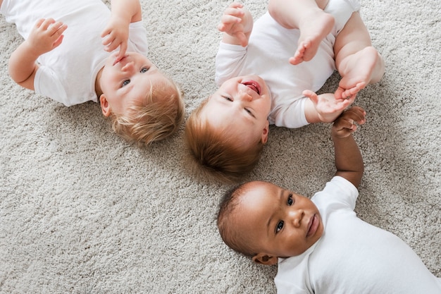 Babies lying on the floor