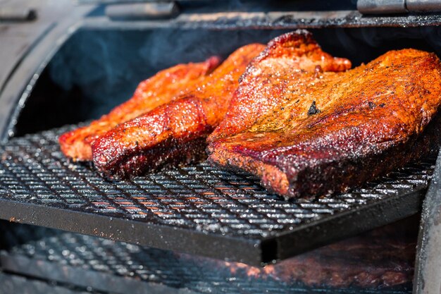 Baby back ribs prepared in smoker.