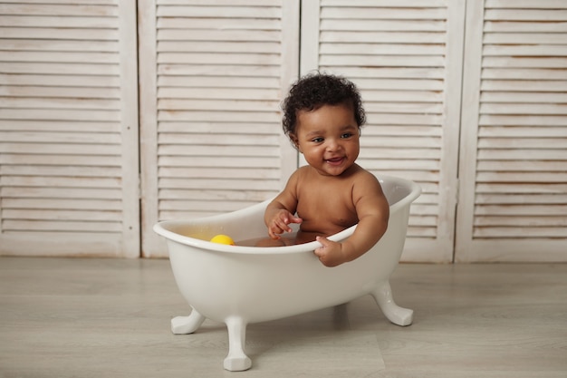 baby bathes in the tub