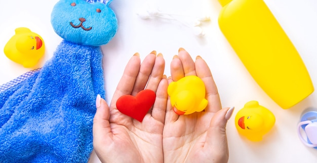 Baby bathing accessories on a white background. Selective focus.