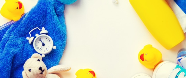 Baby bathing accessories on a white background. Selective focus.