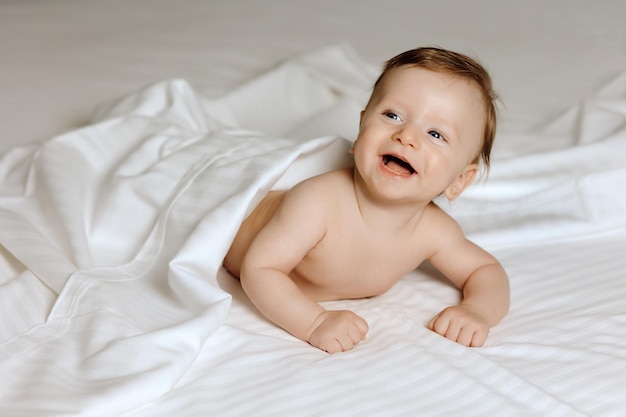 Baby in bed Little baby under white towel