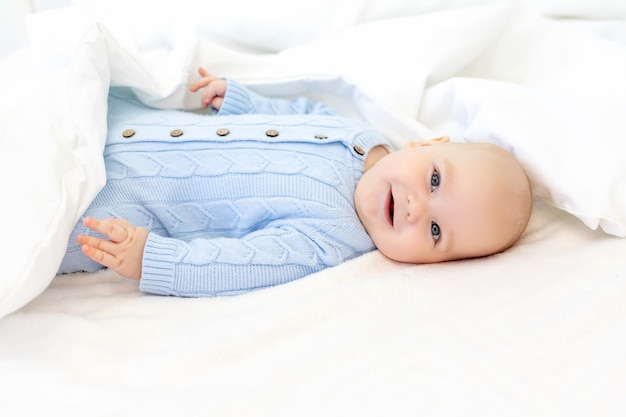 Baby in a blanket, baby morning, textiles and baby bed