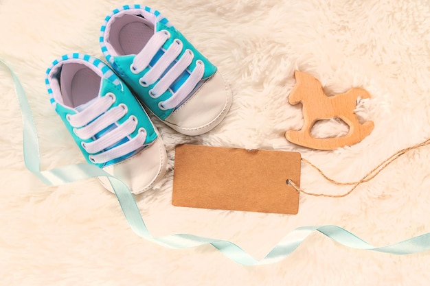 Baby booties accessories on a white background People