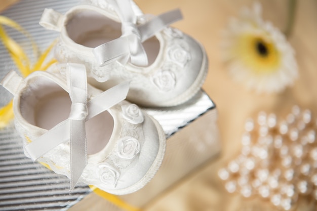 Baby booties on gift box