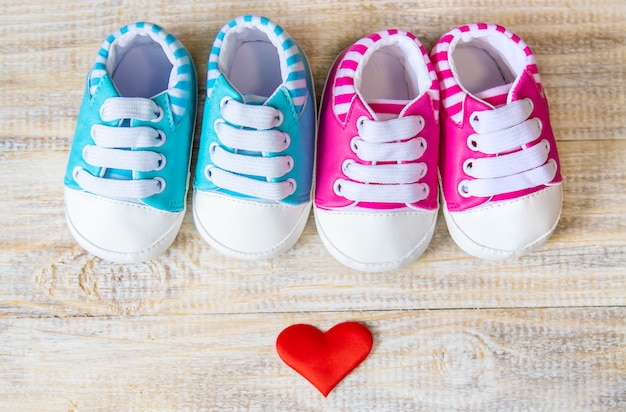 Baby booties and heart on a light. 