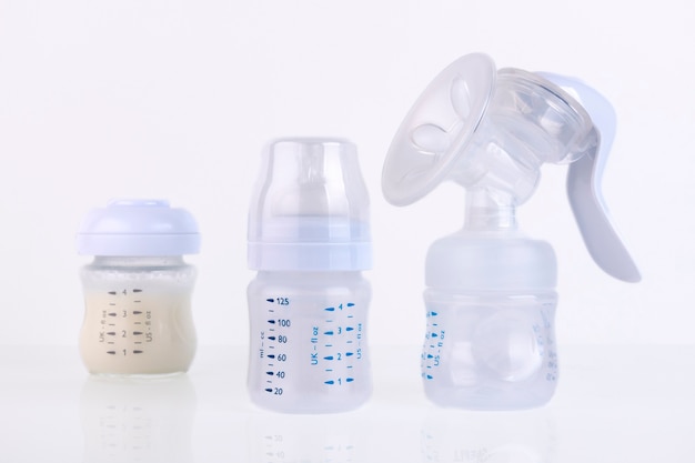 Photo baby bottle with pacifier and milk, for feeding milk and breast pump,