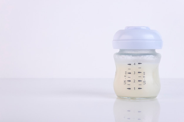 Baby bottle with pacifier and milk for feeding milk