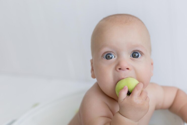 baby in a bowl with apples little boy apples milk bath baby