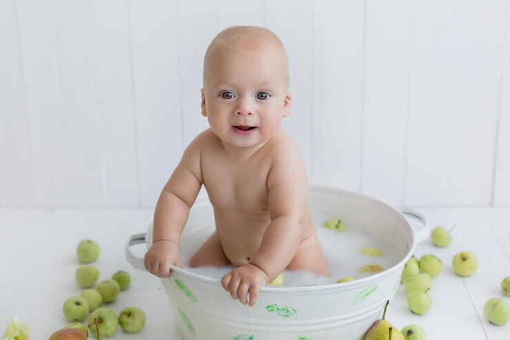 baby in a bowl with apples little boy apples milk bath baby