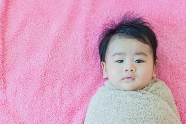 baby boy on the bed