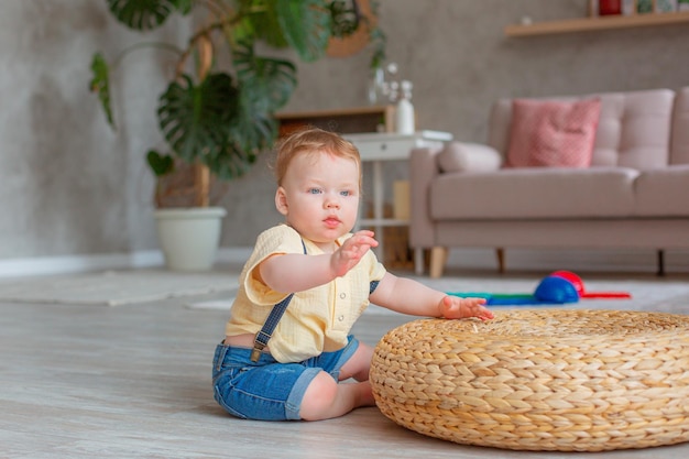 Baby boy crawls on the floor at home