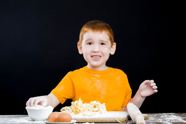 Baby boy in the kitchen while helping with cooking