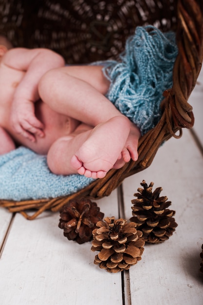 baby boy, photo studio on a wooden background