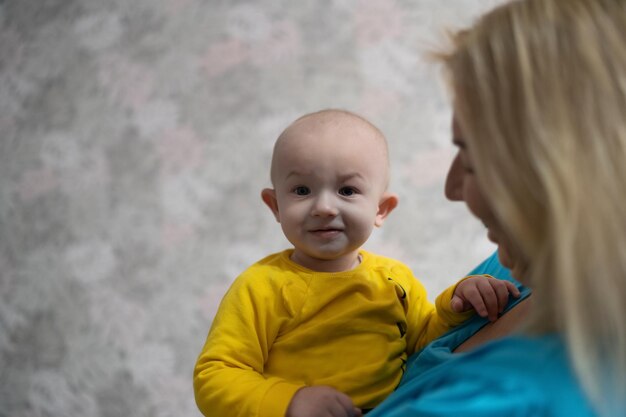 Baby boy playing with his mom at home, lifestyle