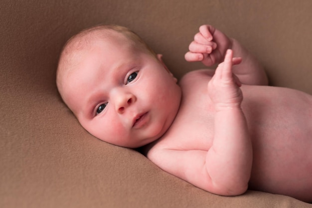 Baby boy posing for his first portrait