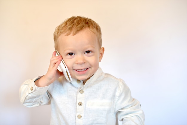 Baby boy talking by smartphone