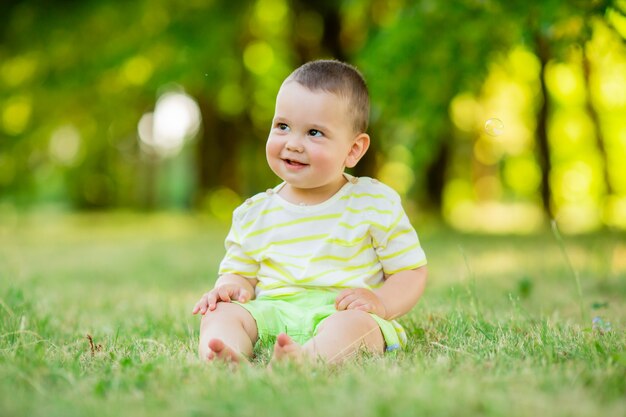 Baby boy on a walk in the park