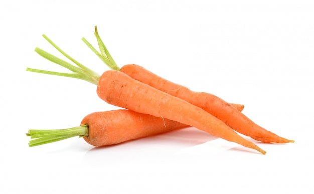 Baby carrots on a white wall