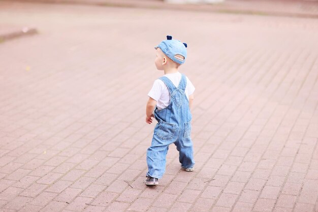 baby child on a summer walk in the park