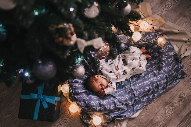 Baby under the christmas tree