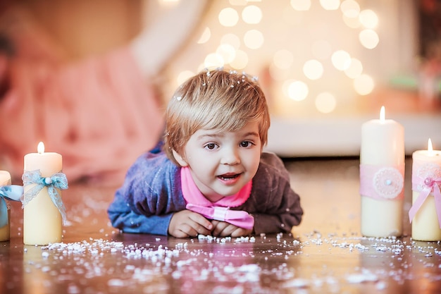 Baby close up on new years eve with big pink bow tie