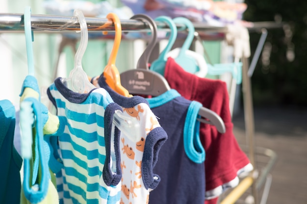 Baby cloth laundry hanging on rack