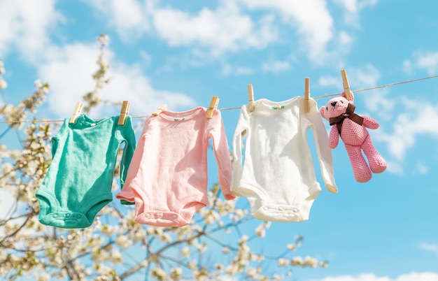 Baby clothes are drying on the street. Selective focus.