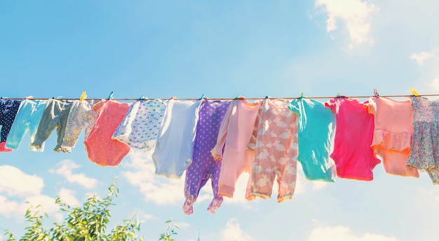 Baby clothes are drying on the street