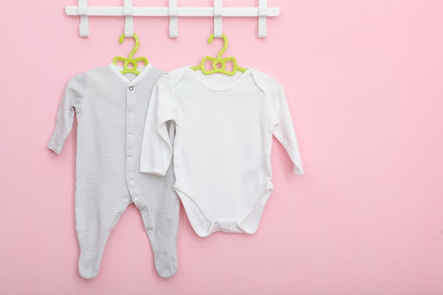 Baby clothes on a hanger place for text minimalism