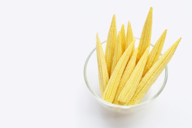 Baby corn in glass bowl on white background.