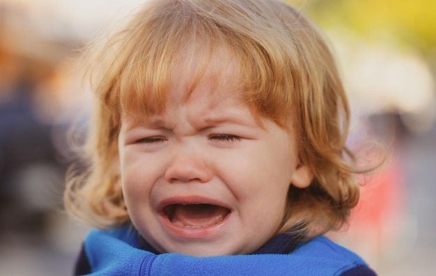 Baby cry close up portrait of a crying kid