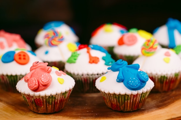 Baby cupcakes on wood