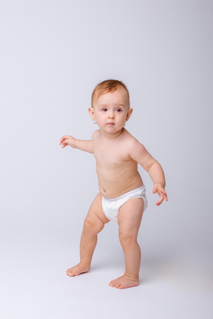 baby in a diaper is isolated on a white background