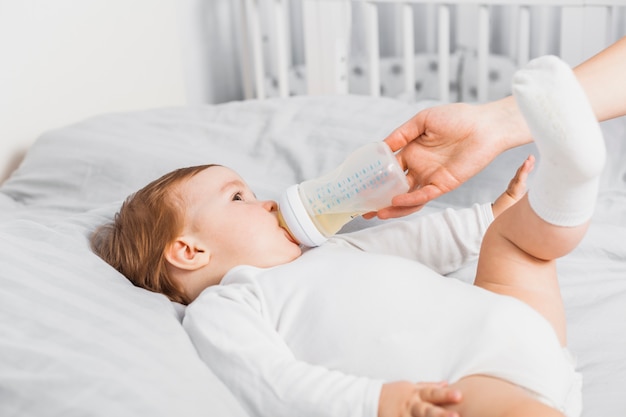 Baby drinking from a baby bottle