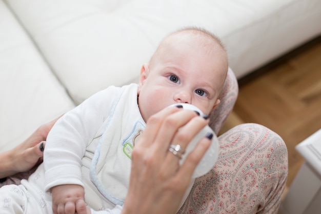 Baby drinking milk from a bottle