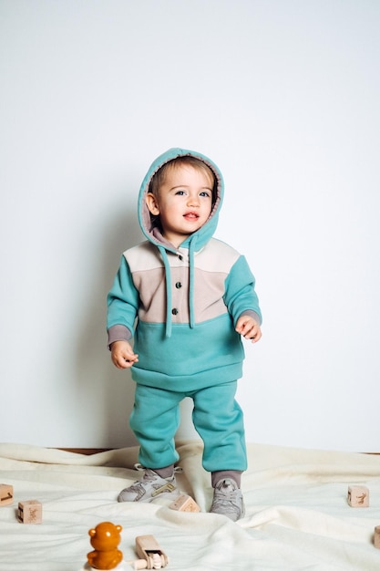 Baby fashion unisex clothes for babies cute baby in cotton set suit on light background