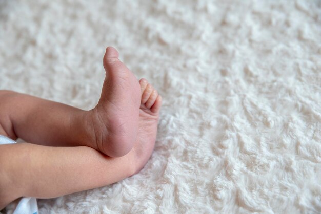 Baby feet on coverlet
