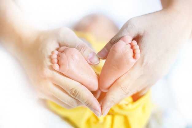 Baby feet in mother hands