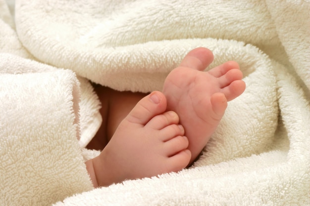 Baby feet in towel