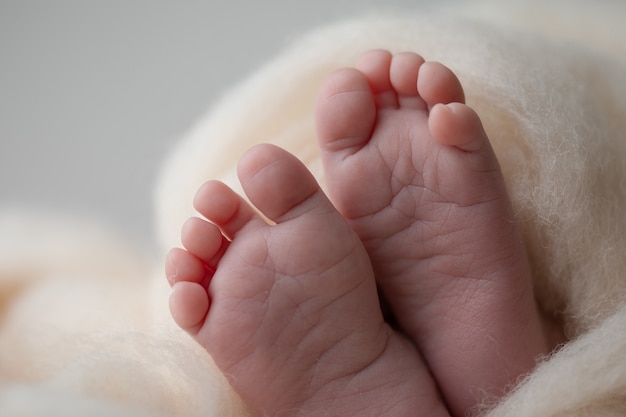 Baby feet on a white background babys life the baby in the crib a blank sheet