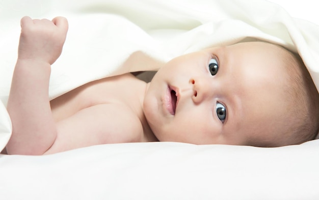 Baby girl After Bath Wrapped in Red Towel Laying and Posing