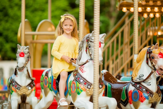 baby girl on the carousel