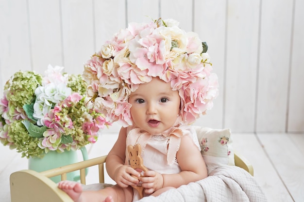 Baby girl in flower hat Postcard Mother's Day and Easter Children Protection Day World Happiness Day Smiling child