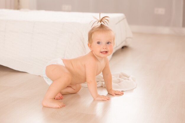 baby girl in the nursery playing