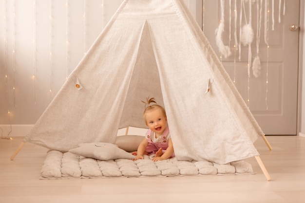 baby girl playing in the nursery