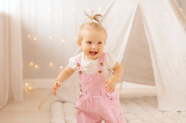 baby girl playing in the nursery